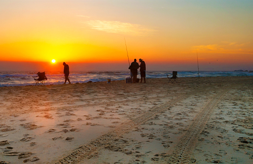 Fishermen setting up at daybreak on Surf Beach, Narooma. Australia